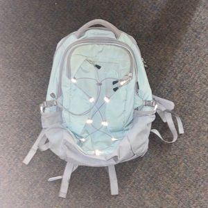This is a grey and aqua colored Borealis Northface, backpack.